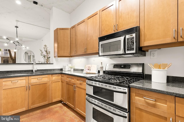1700 Kalorama Rd NW Unit 206, Washington, DC 20009 - kitchen with range with two ovens, a sink, dark stone counters, a chandelier, and finished concrete flooring