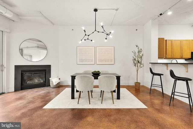 1700 Kalorama Rd NW Unit 206, Washington, DC 20009 - dining room featuring a chandelier and a glass covered fireplace