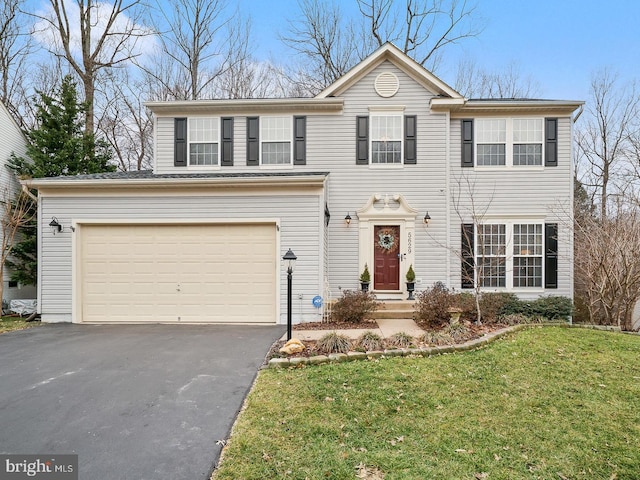 5629 Eppes Island Pl, Manassas, VA 20112 - view of front of home with asphalt driveway, a front yard, and an attached garage