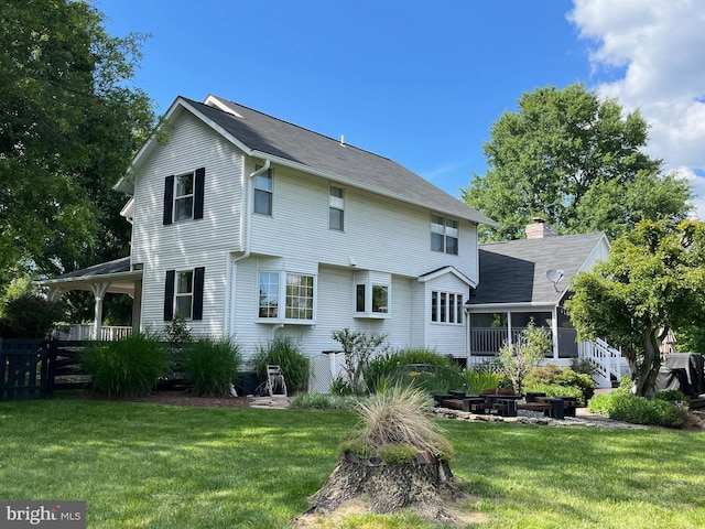 241 Clayhill Dr, Winchester, VA 22602 - rear view of property with a sunroom and an outdoor fire pit