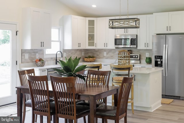 2836 Cameron Rd, Falls Church, VA 22042 - kitchen featuring stainless steel appliances, light countertops, healthy amount of natural light, light wood-type flooring, and recessed lighting