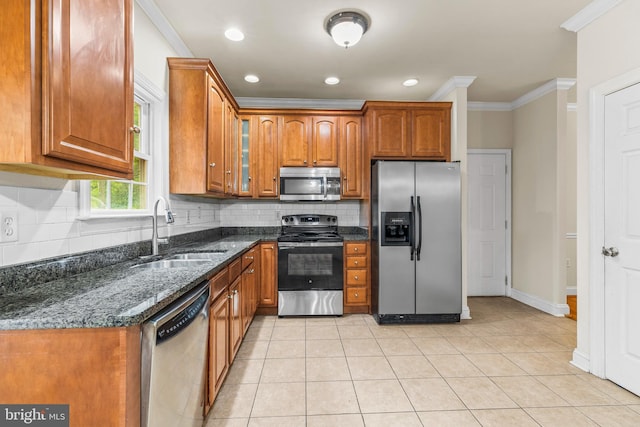22 Berry Ln, Harpers Ferry, WV 25425 - kitchen featuring appliances with stainless steel finishes, a sink, crown molding, tasteful backsplash, and brown cabinetry