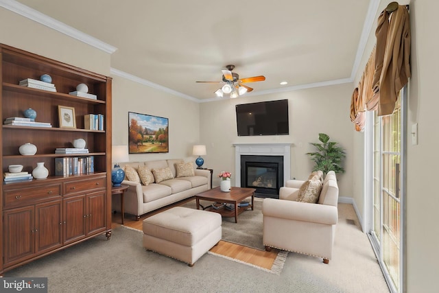 22 Berry Ln, Harpers Ferry, WV 25425 - living room with a ceiling fan, ornamental molding, a glass covered fireplace, and light wood finished floors