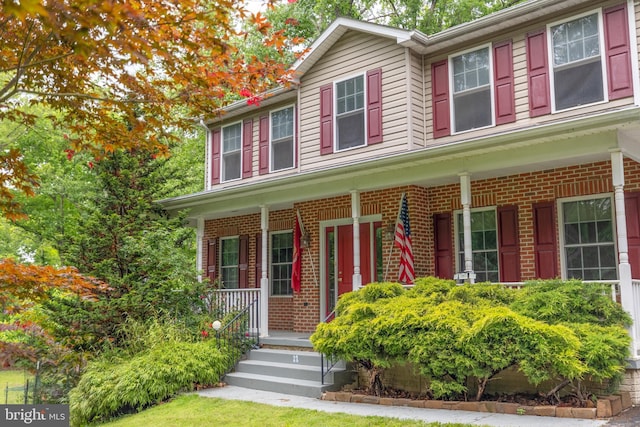 22 Berry Ln, Harpers Ferry, WV 25425 - view of front of property with covered porch and brick siding