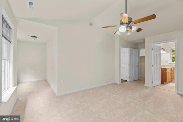 22 Berry Ln, Harpers Ferry, WV 25425 - unfurnished bedroom featuring light carpet, baseboards, lofted ceiling, a spacious closet, and ceiling fan