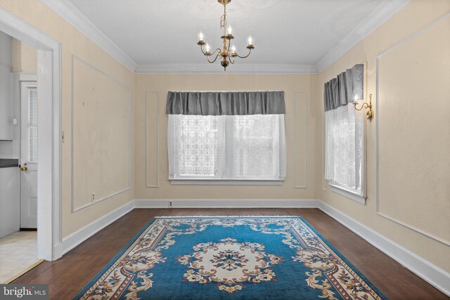 15 E Grant St, Woodstown, NJ 08098 - unfurnished dining area featuring a chandelier, wood finished floors, crown molding, and baseboards