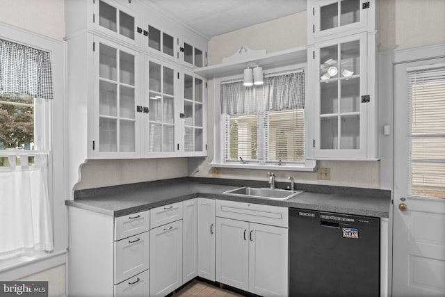 15 E Grant St, Woodstown, NJ 08098 - kitchen featuring black dishwasher, a sink, dark countertops, and white cabinets