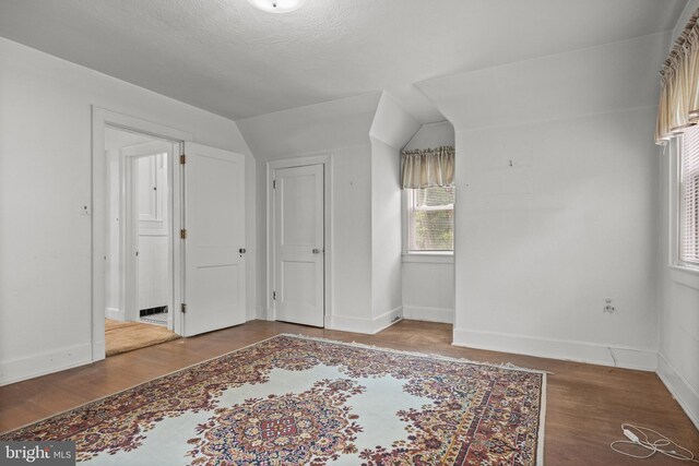 15 E Grant St, Woodstown, NJ 08098 - unfurnished bedroom with wood finished floors, vaulted ceiling, and baseboards