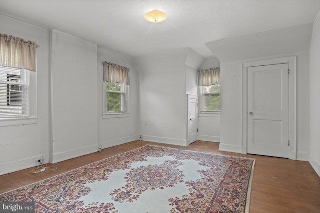 15 E Grant St, Woodstown, NJ 08098 - spare room featuring wood finished floors, vaulted ceiling, plenty of natural light, and baseboards