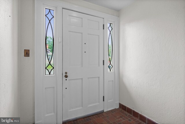 15 E Grant St, Woodstown, NJ 08098 - foyer entrance featuring baseboards and brick patterned floors