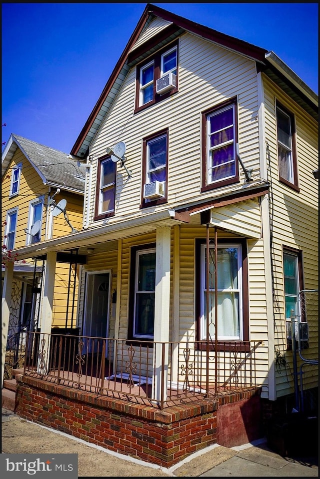 133 Suydam St, New Brunswick, NJ 08901 - view of front of house with covered porch and cooling unit