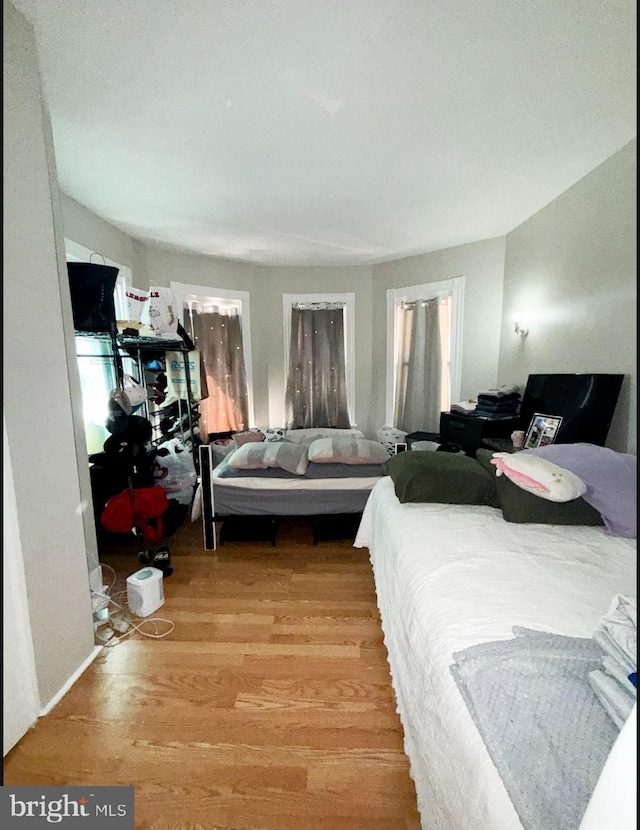 133 Suydam St, New Brunswick, NJ 08901 - bedroom with wood finished floors