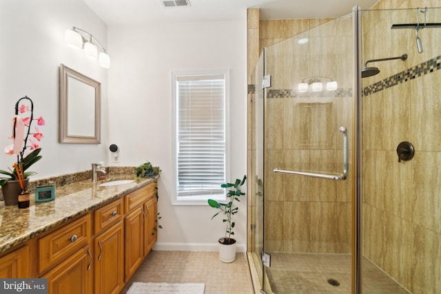5310 B St SE, Washington, DC 20019 - full bath featuring vanity, a shower stall, baseboards, and tile patterned flooring