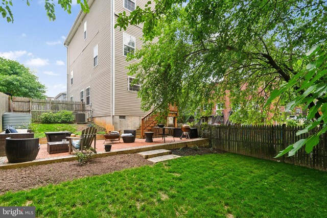 5310 B St SE, Washington, DC 20019 - view of yard with an outdoor fire pit, a patio area, central AC unit, and stairway