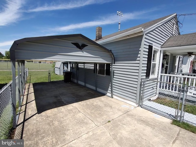 427 Camper St, Cambridge, MD 21613 - porch with concrete driveway and a gate
