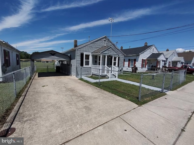 427 Camper St, Cambridge, MD 21613 - view of front of home with a carport, covered porch, and driveway