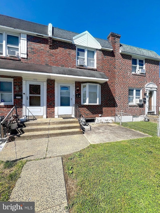 1933 Carter Rd, Folcroft, PA 19032 - view of property featuring a front lawn, brick siding, and cooling unit