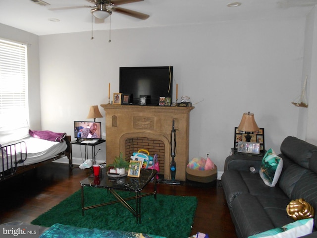 4708 Frederick Ave, Baltimore, MD 21229 - living area with wood finished floors, ceiling fan, and a fireplace