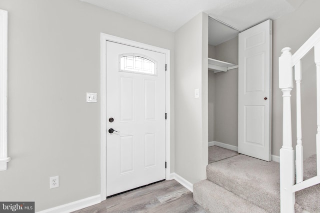 231 Ivanhoe Ct, Fredericksburg, VA 22401 - foyer entrance with stairs, wood finished floors, and baseboards