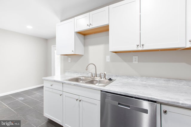 231 Ivanhoe Ct, Fredericksburg, VA 22401 - kitchen featuring stainless steel dishwasher, a sink, white cabinets, light countertops, and baseboards