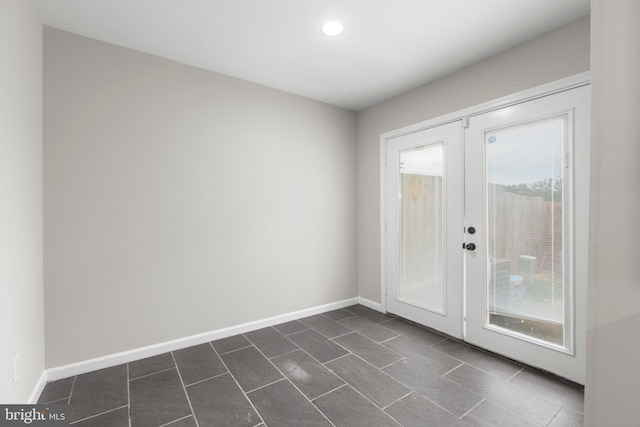 231 Ivanhoe Ct, Fredericksburg, VA 22401 - empty room with french doors, dark tile patterned flooring, baseboards, and recessed lighting