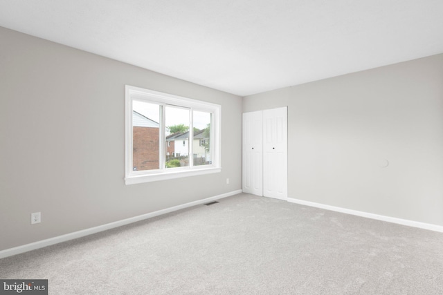 231 Ivanhoe Ct, Fredericksburg, VA 22401 - unfurnished bedroom featuring baseboards, carpet flooring, and a closet