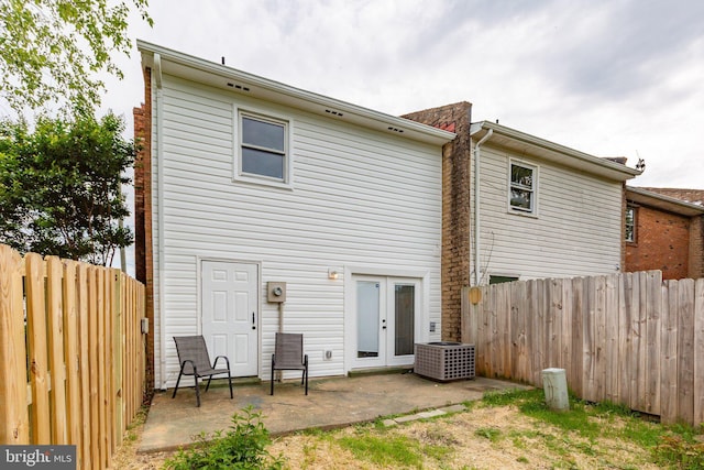 231 Ivanhoe Ct, Fredericksburg, VA 22401 - rear view of property featuring a patio, french doors, a fenced backyard, and central AC