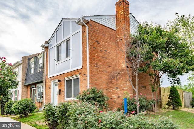 231 Ivanhoe Ct, Fredericksburg, VA 22401 - view of front facade with brick siding, a chimney, and board and batten siding