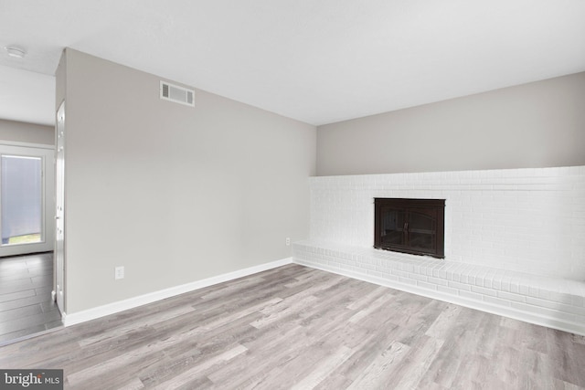 231 Ivanhoe Ct, Fredericksburg, VA 22401 - unfurnished living room featuring wood finished floors, baseboards, and a fireplace
