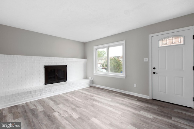 231 Ivanhoe Ct, Fredericksburg, VA 22401 - unfurnished living room featuring wood finished floors, a fireplace, and baseboards