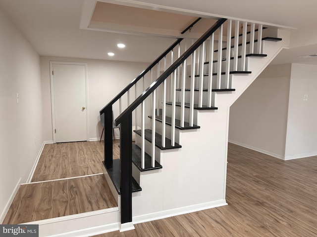 5420 Eastbourne Dr, Springfield, VA 22151 - stairs featuring wood finished floors, recessed lighting, and baseboards