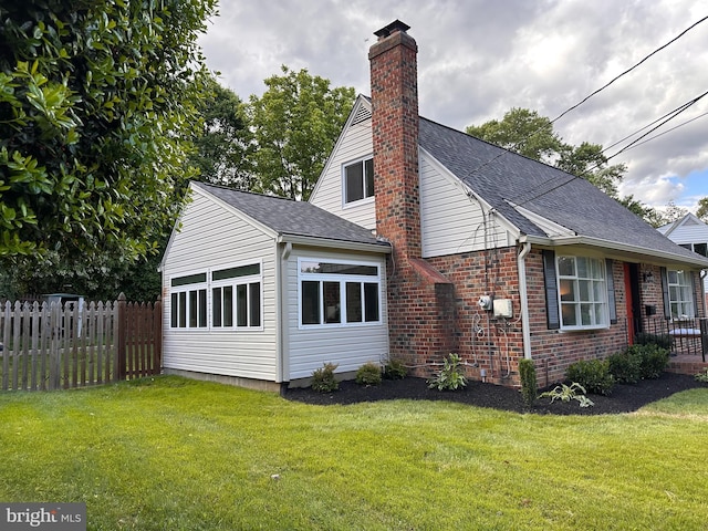 5420 Eastbourne Dr, Springfield, VA 22151 - view of side of home with a chimney, brick siding, and roof with shingles