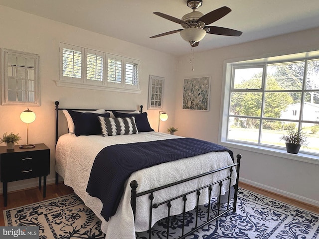 5420 Eastbourne Dr, Springfield, VA 22151 - bedroom featuring multiple windows, wood finished floors, and baseboards