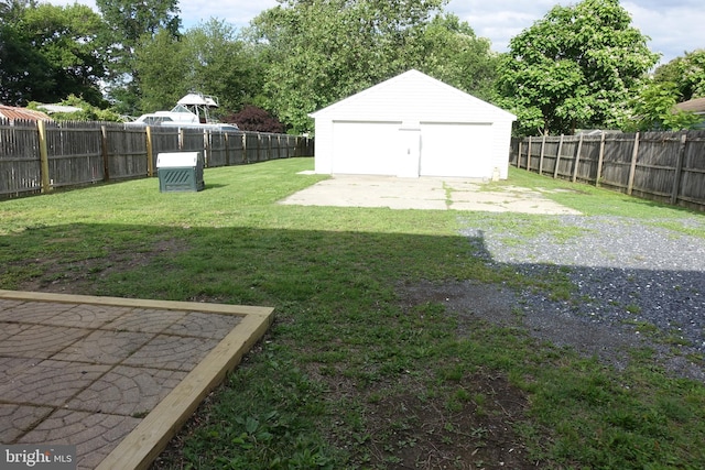 413 Dominion Rd, Chester, MD 21619 - view of yard featuring a garage and an outbuilding