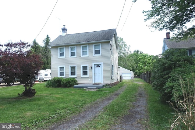 413 Dominion Rd, Chester, MD 21619 - colonial home featuring a garage, a front lawn, and a chimney