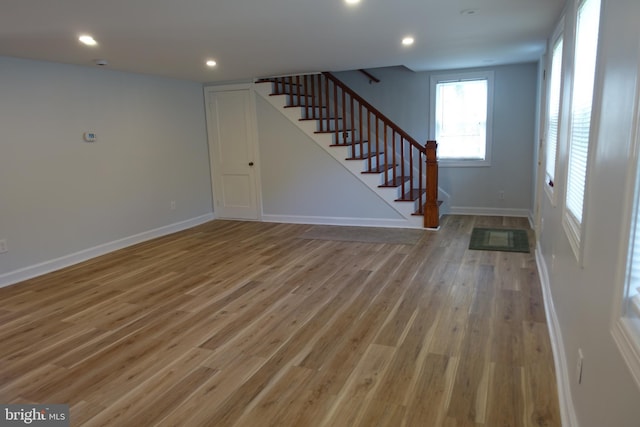 413 Dominion Rd, Chester, MD 21619 - unfurnished living room featuring stairs, light wood-style floors, baseboards, and recessed lighting