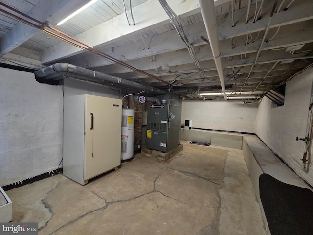 336 Bar Harbor Rd, Pasadena, MD 21122 - unfinished basement featuring water heater, heating unit, and freestanding refrigerator