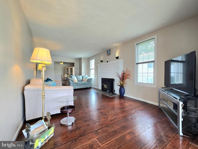 336 Bar Harbor Rd, Pasadena, MD 21122 - living area featuring hardwood / wood-style floors, a fireplace with flush hearth, baseboards, and a ceiling fan