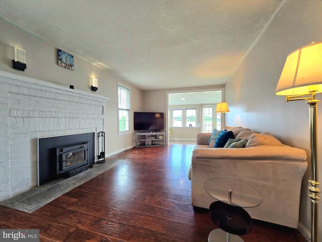 336 Bar Harbor Rd, Pasadena, MD 21122 - living area featuring hardwood / wood-style flooring, a brick fireplace, and baseboards