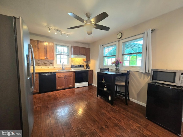 336 Bar Harbor Rd, Pasadena, MD 21122 - kitchen featuring stainless steel appliances, a sink, under cabinet range hood, dark wood-style flooring, and light countertops