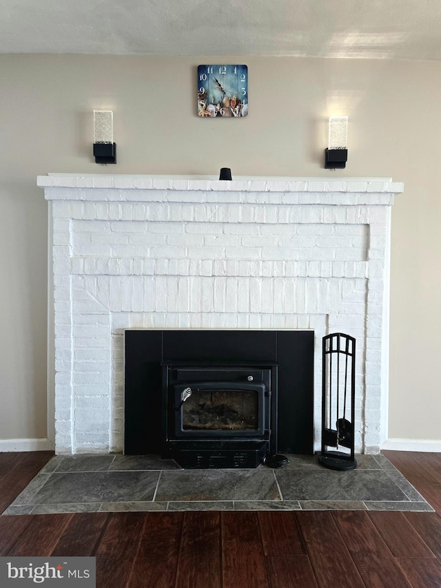 336 Bar Harbor Rd, Pasadena, MD 21122 - detailed view of a brick fireplace, wood finished floors, and baseboards