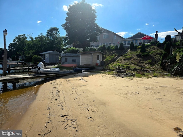 336 Bar Harbor Rd, Pasadena, MD 21122 - view of yard with a dock and driveway