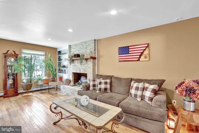199 Applegate, Hamilton, NJ 08690 - living room featuring wood-type flooring, a baseboard heating unit, recessed lighting, and a brick fireplace