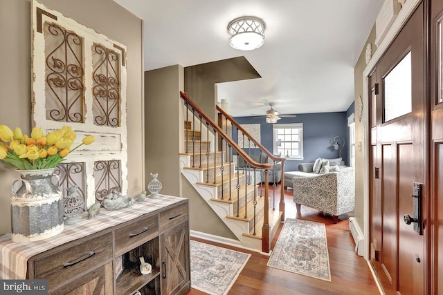 199 Applegate, Hamilton, NJ 08690 - foyer with a baseboard heating unit, dark wood finished floors, stairway, a ceiling fan, and baseboards