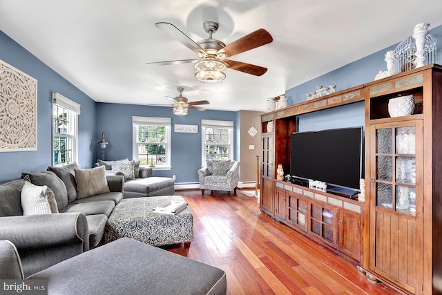 199 Applegate, Hamilton, NJ 08690 - living room with a baseboard radiator, wood finished floors, a ceiling fan, and baseboards