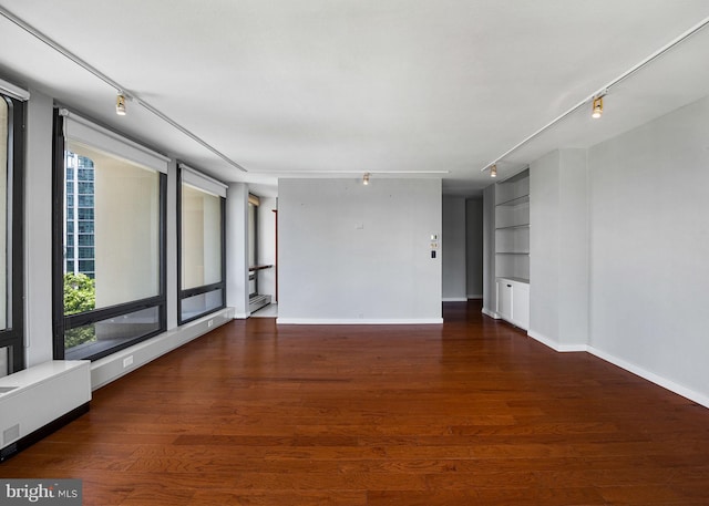 220 Locust St Unit 7As, Philadelphia, PA 19106 - spare room with rail lighting, wood finished floors, and built in features