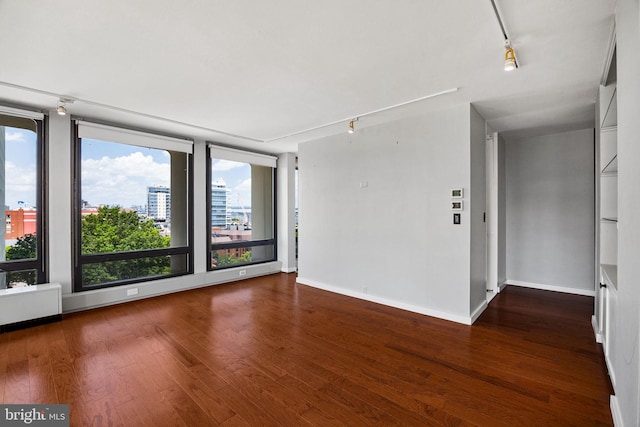 220 Locust St Unit 7As, Philadelphia, PA 19106 - empty room featuring rail lighting, wood finished floors, and plenty of natural light