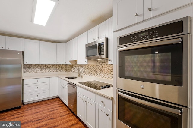 8370 Greensboro Dr Unit 508, Mclean, VA 22102 - kitchen featuring stainless steel appliances, a sink, light countertops, and white cabinets