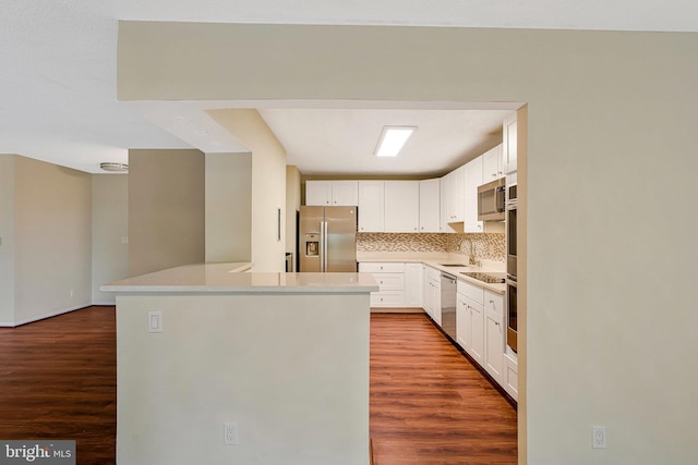 8370 Greensboro Dr Unit 508, Mclean, VA 22102 - kitchen with appliances with stainless steel finishes, wood finished floors, and white cabinetry