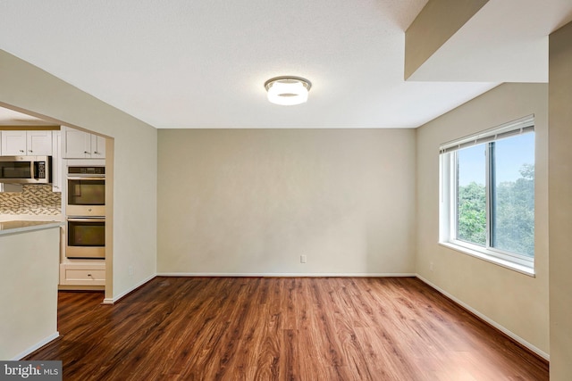8370 Greensboro Dr Unit 508, Mclean, VA 22102 - unfurnished room featuring wood finished floors and baseboards